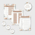 Baby shower game cards and decorative stickers with floral designs on a white background