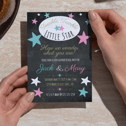 A person holds a 'Twinkle, Twinkle Little Star' baby shower invitation card with hands against a light stone countertop background.