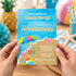 A person holds a beach-themed birthday invitation card in front of a blurred beach party background. The card features a blue watercolor sky, sandy beach, colorful beach umbrella, starfish, and a beach ball, with text reading 'You're invited to a Beach Party! Jack's Birthday' and event details.