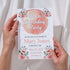 Birthday party invitation held by hands with floral design