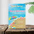 Beach party invitation with colorful design on a wooden surface