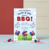Fourth of July BBQ invitation with grill, balloons, and fireworks on a blue background.