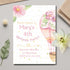 Birthday party invitation with pink balloons and flowers on a light gray surface.