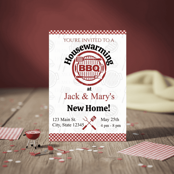 Housewarming BBQ invitation card on a wooden table with party decorations.