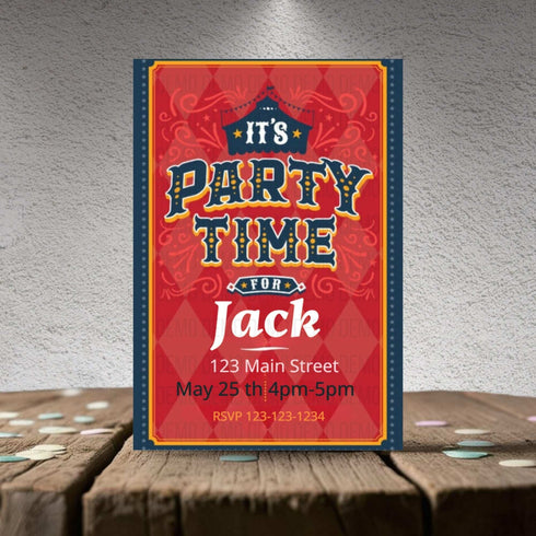 Party invitation card for 'It's Party Time for Jack' on a wooden surface with a textured gray background.