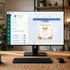 A desktop monitor on a wooden desk displays an editable online template design for a fall-themed 'Refreshments' sign. The screen shows the Sunny Jar Events design interface with autumn decorations like pumpkins, leaves, and a bird.