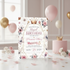 Royal birthday celebration with invitation card, cake, and balloons.