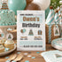 A birthday invitation card for 'Owen's Birthday' is displayed in a styled party setting with a decorated cake, cupcakes, party hats, balloons, and wrapped gifts on a wooden table.