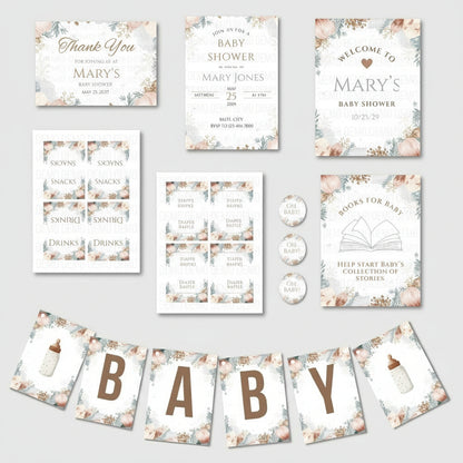 Collection of baby shower invitations, signs, and decorations on a white background