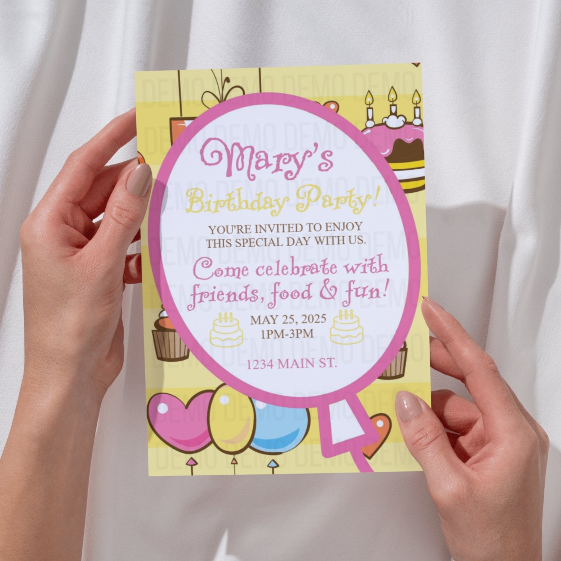 Birthday party invitation held by hands with a white background