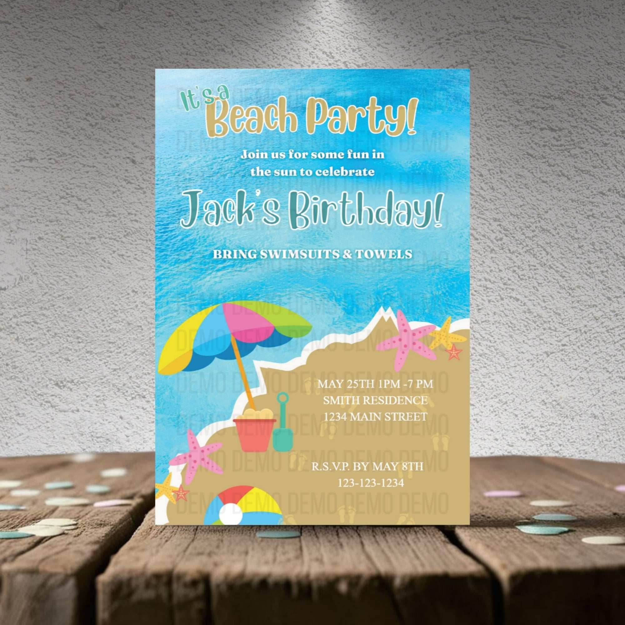 Beach party invitation with sand, umbrella, and starfish design on a textured surface.