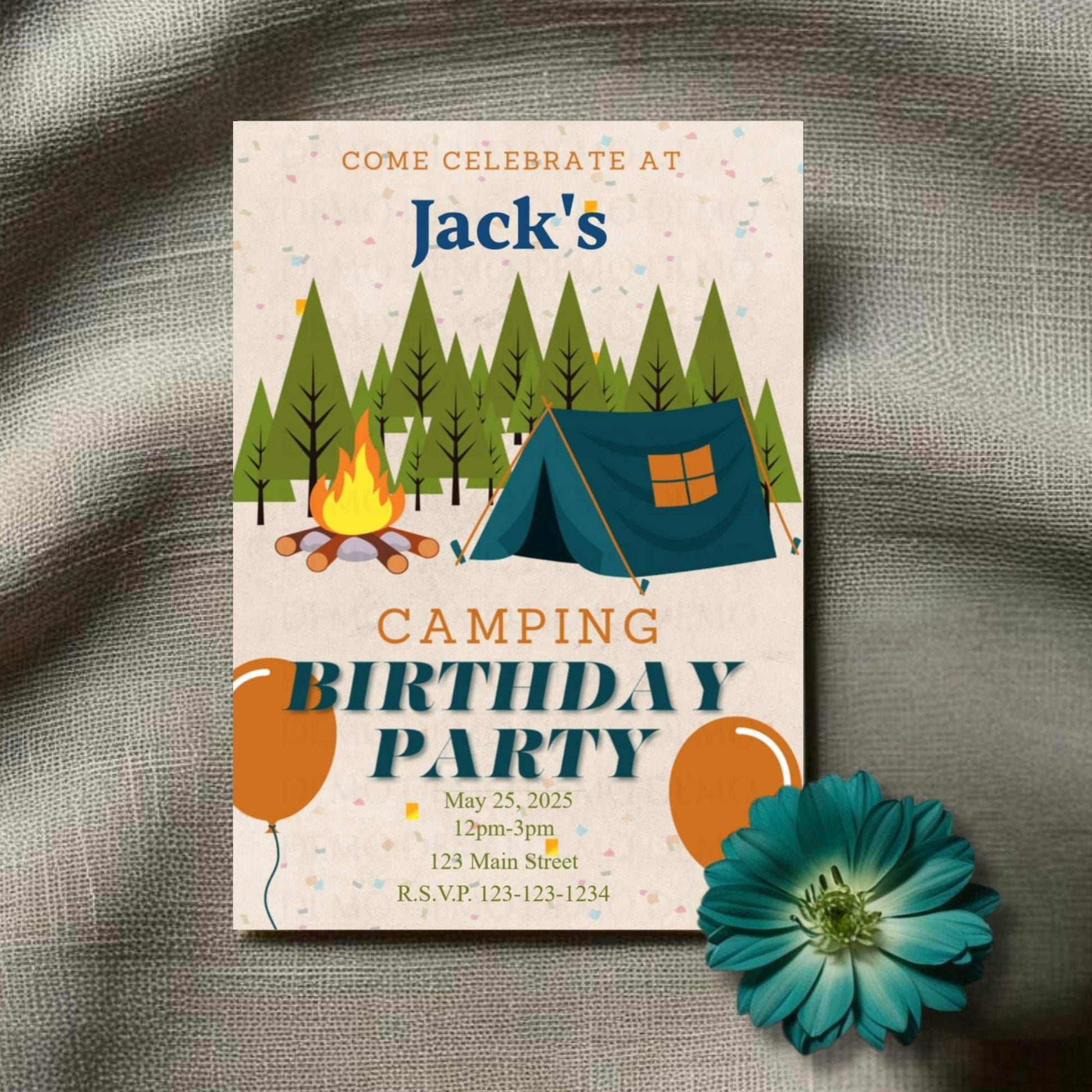 Birthday party invitation with camping theme on a textured surface with a flower.