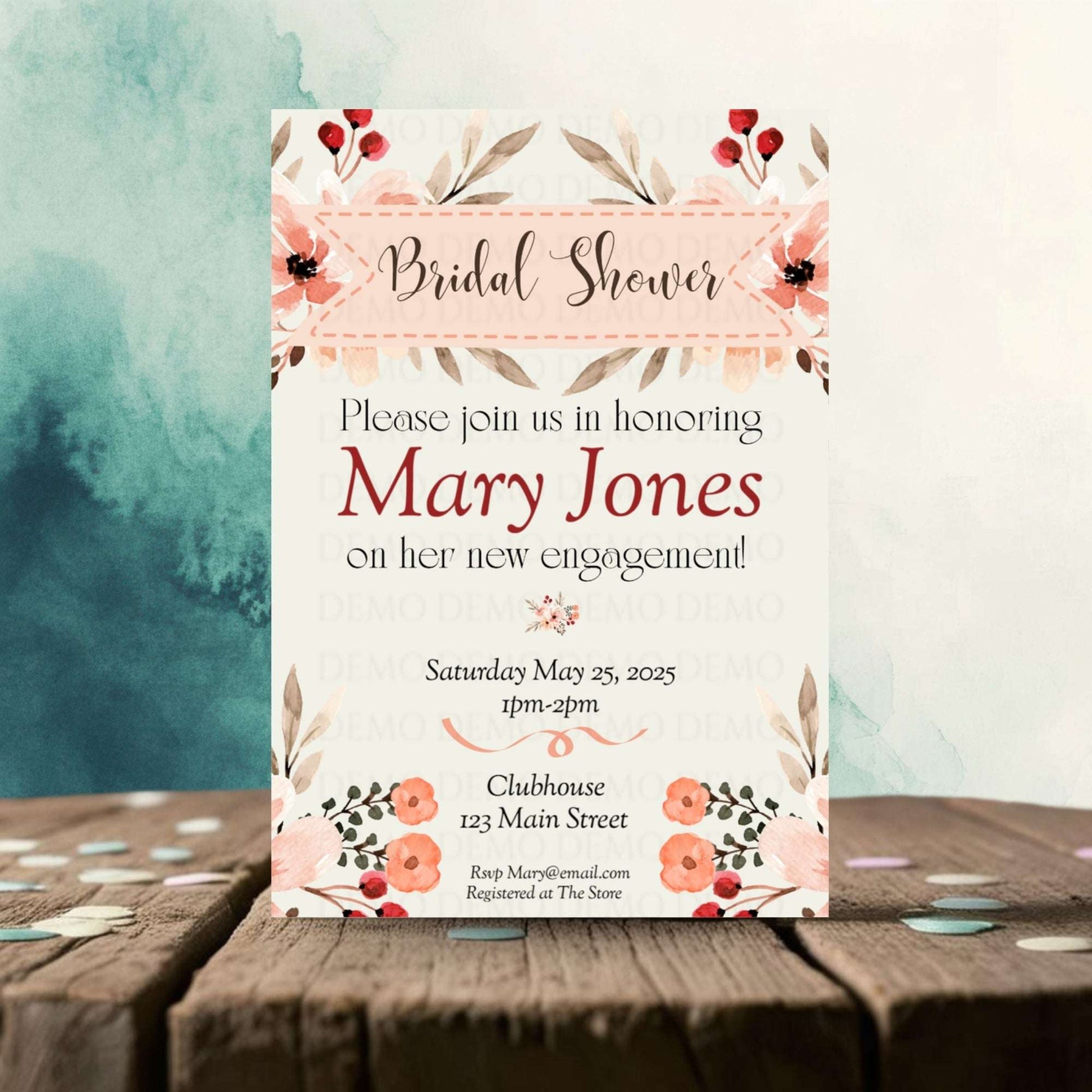 Bridal shower invitation with floral design on a wooden surface