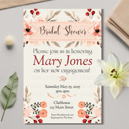 Bridal shower invitation with floral design on a light gray surface with flowers and leaves.