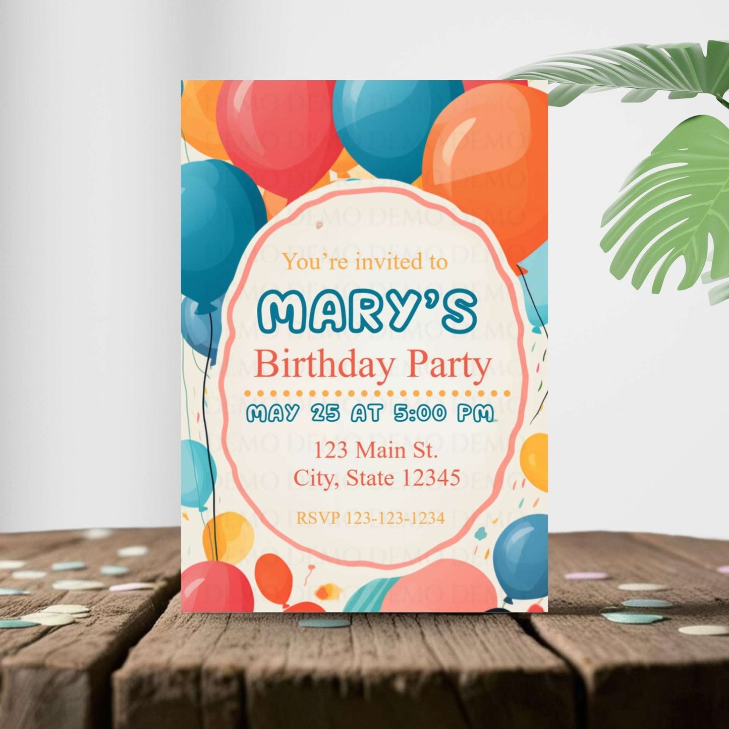 Birthday party invitation with colorful balloons on a wooden surface