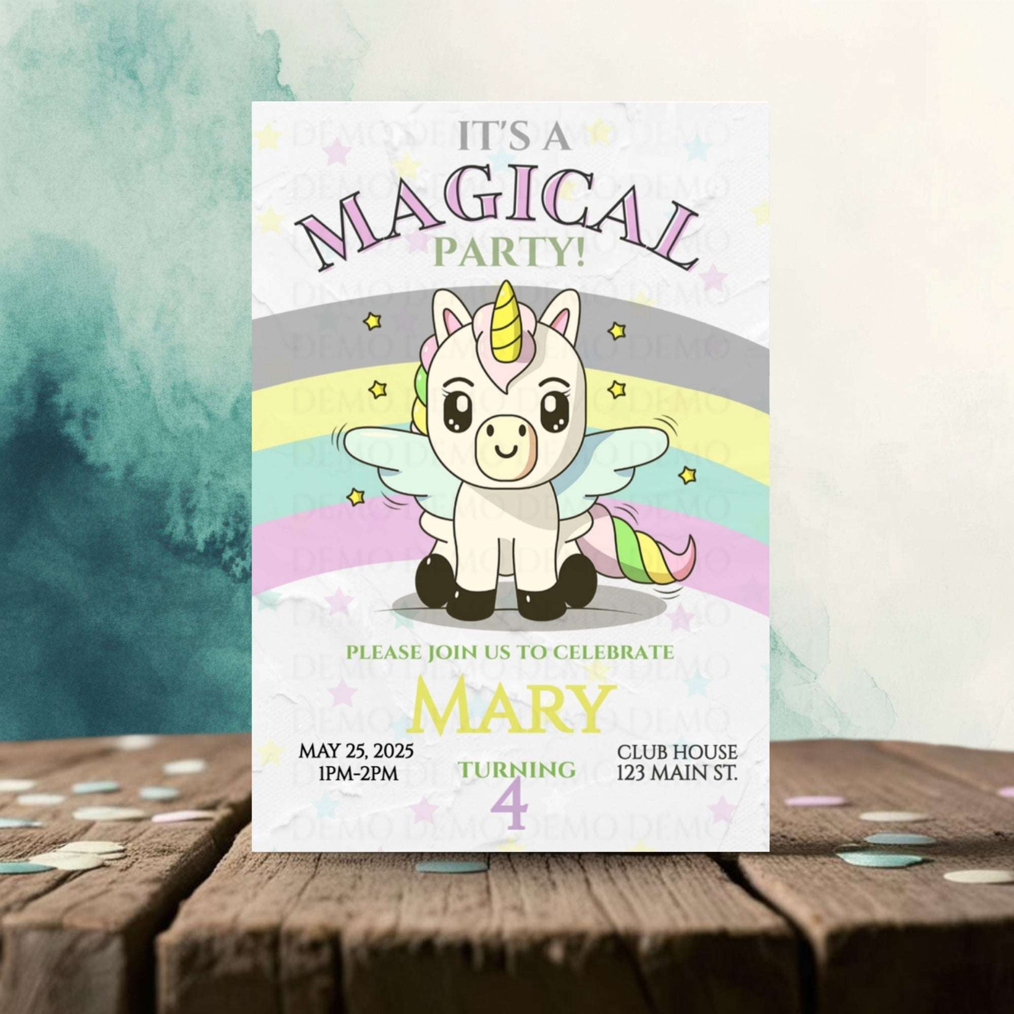 Invitation card with a unicorn design on a wooden surface