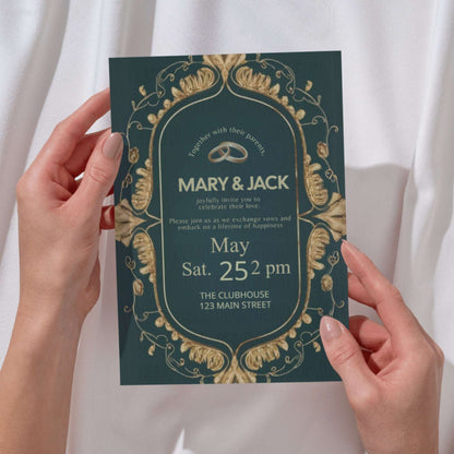 Wedding invitation card held by hands with decorative gold design on a white background