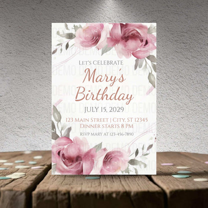 Birthday invitation card with pink roses on a wooden surface and gray background
