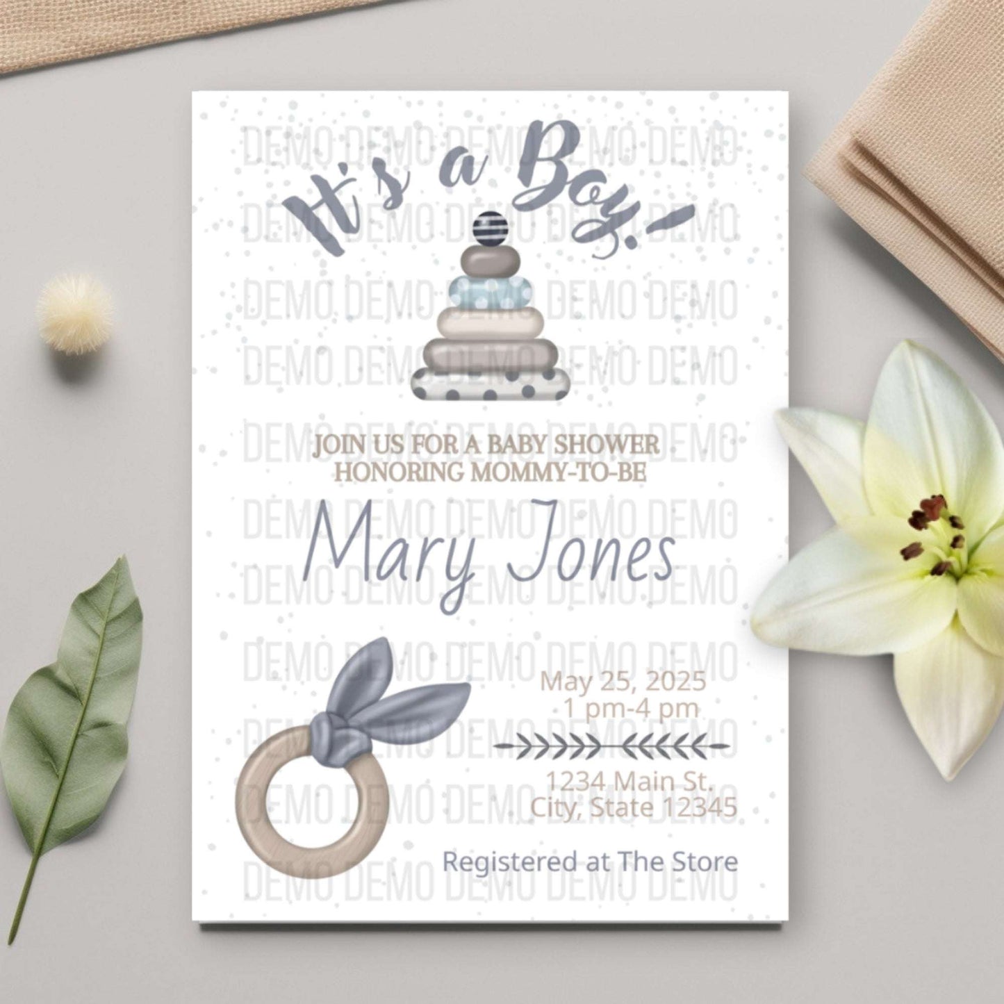 Baby shower invitation for a boy with cake, bow tie, and flower decorations on a light gray background.