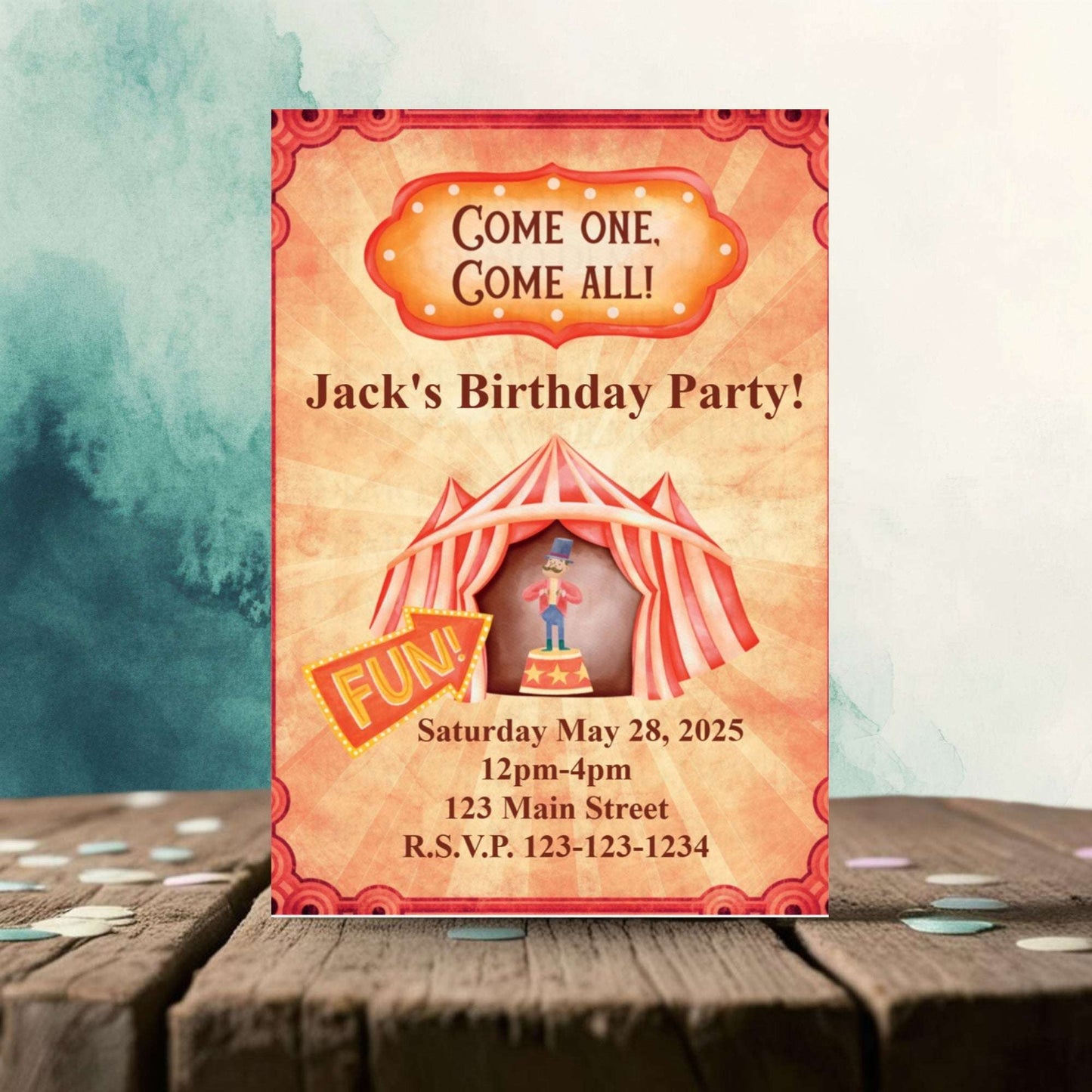 Birthday party invitation with circus tent design on a wooden surface