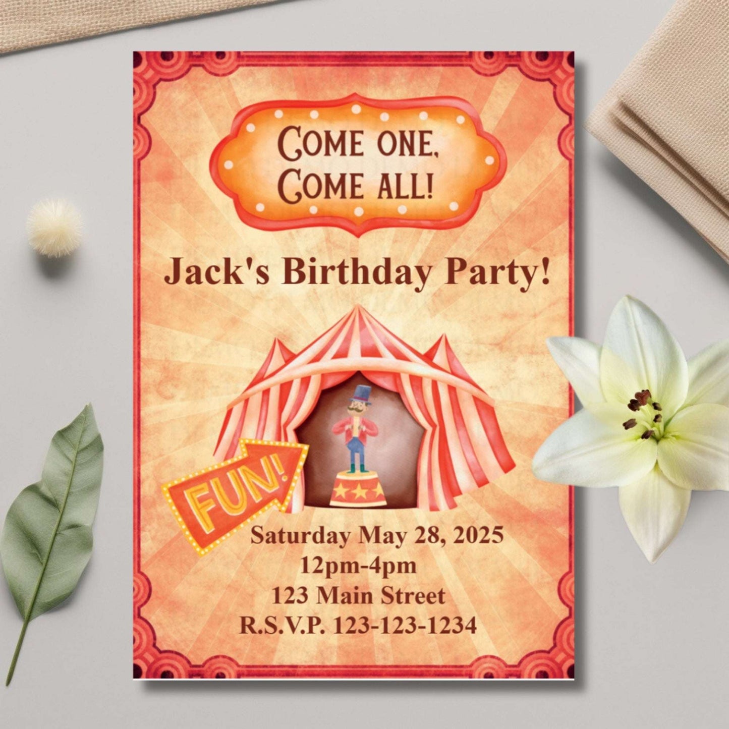 Birthday party invitation with a circus theme on a light gray surface with decorative elements.