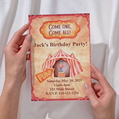 Circus-themed birthday party invitation held by hands against a white background