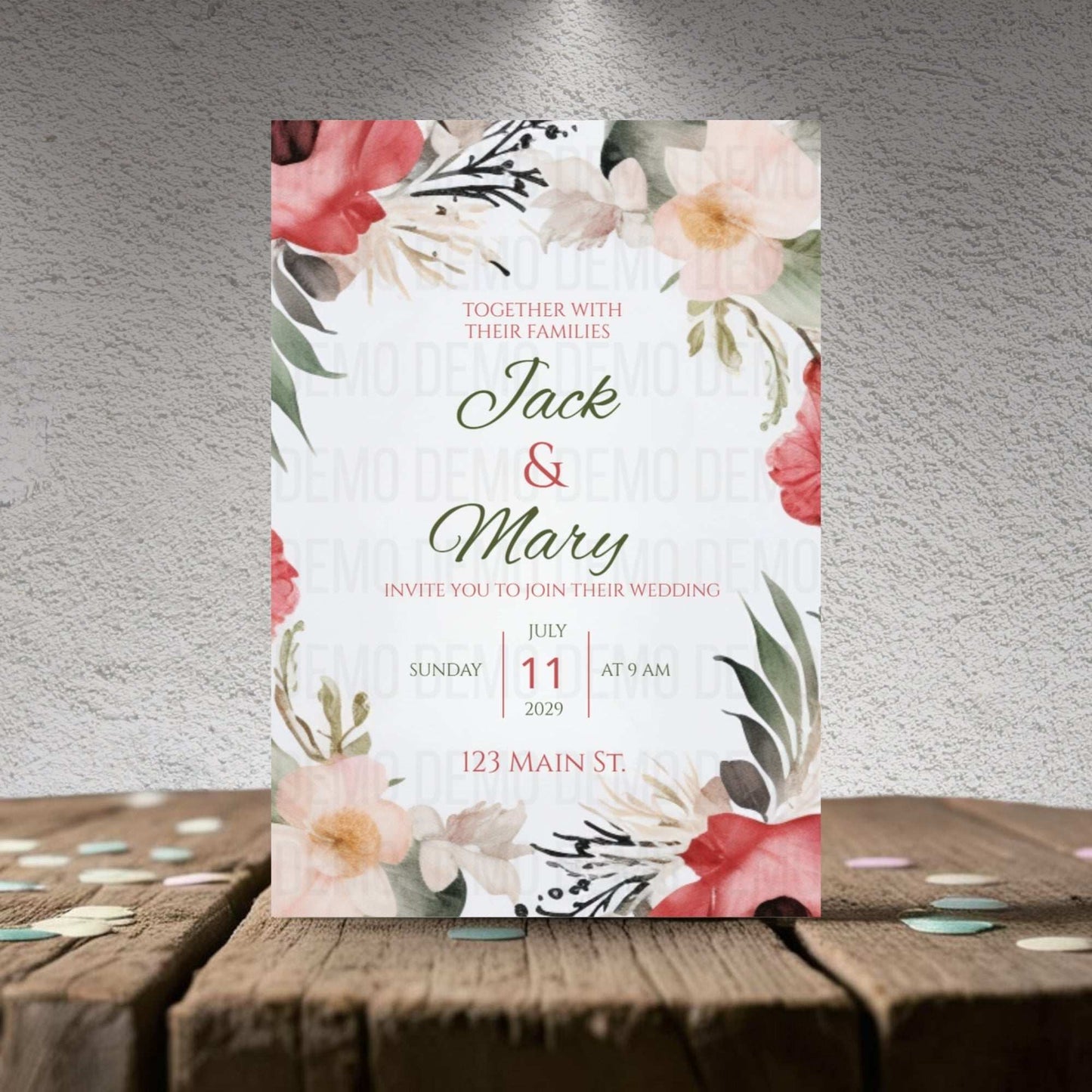 Wedding invitation card with floral design on a wooden surface