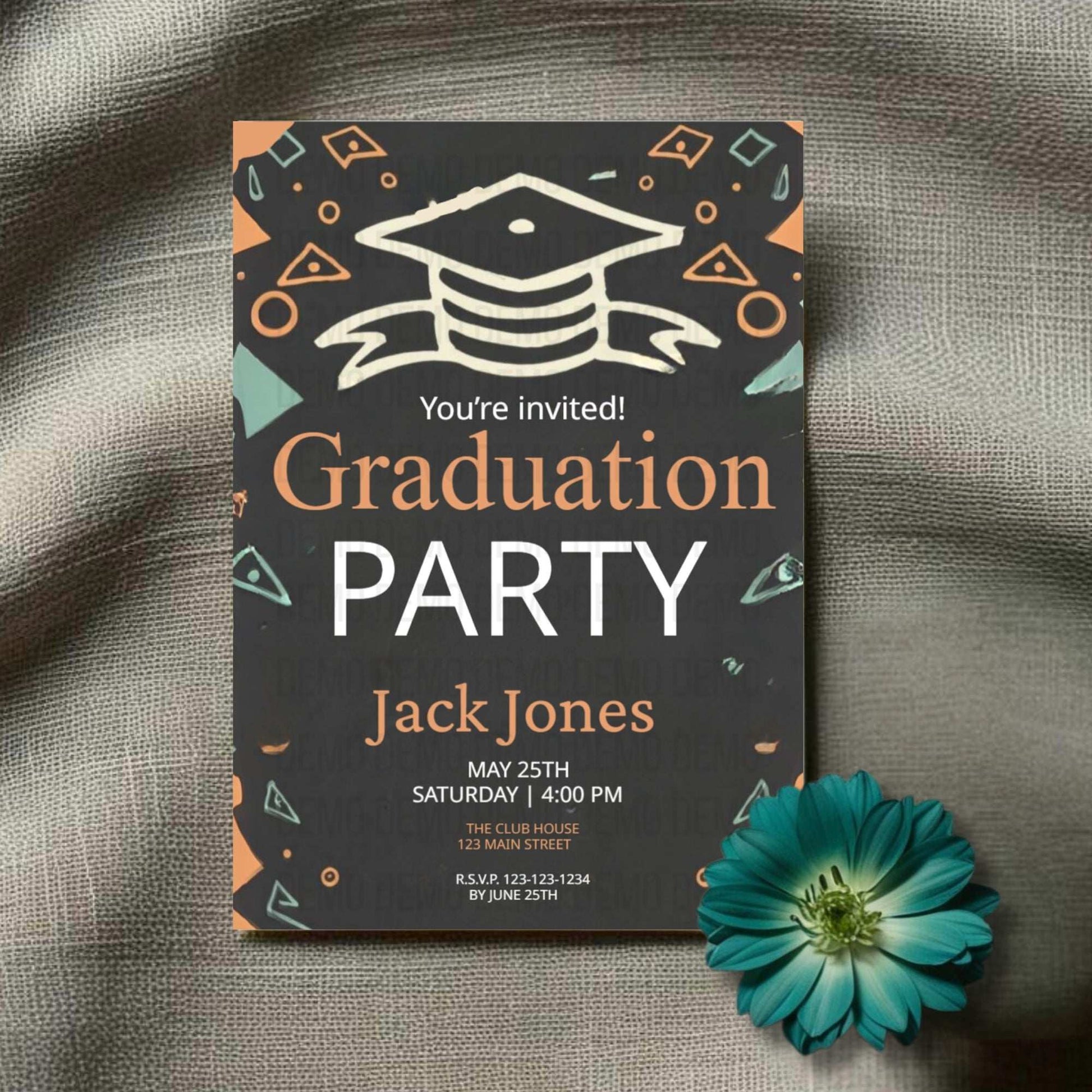 Graduation party invitation with a blue flower on a textured surface