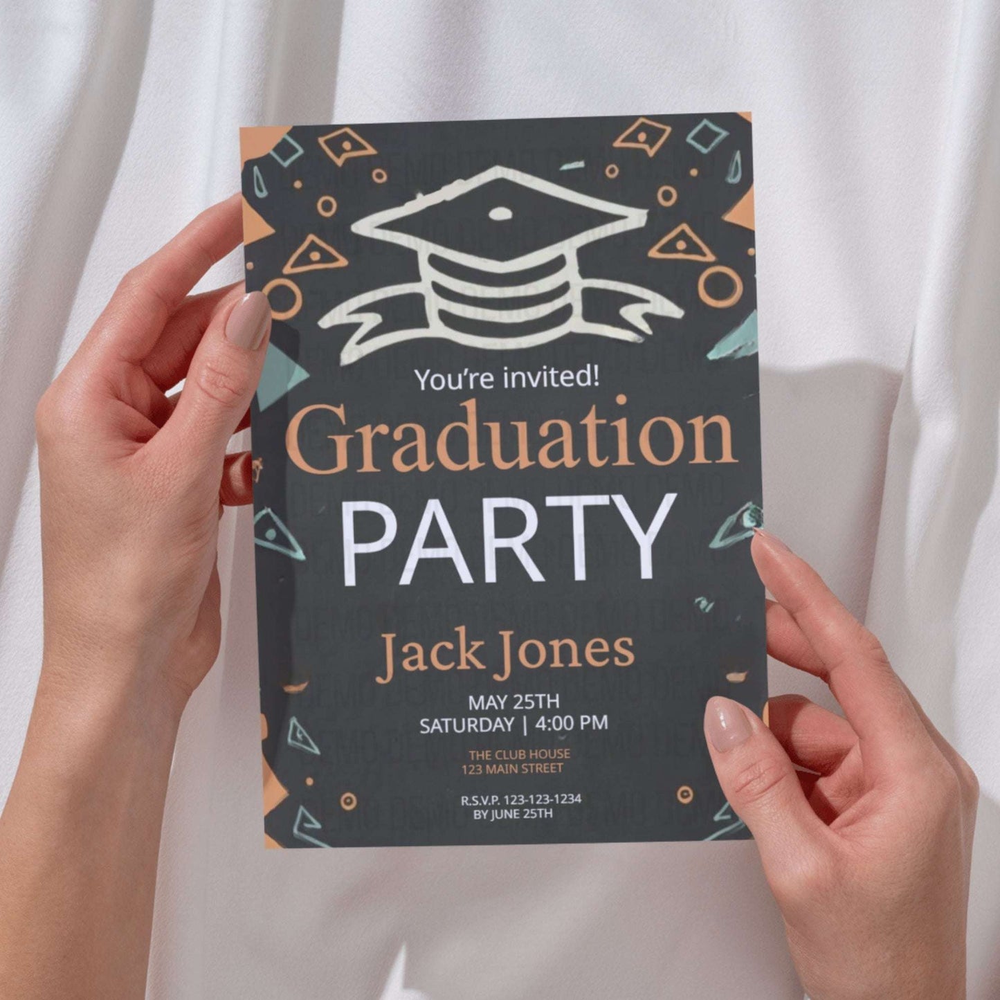 Graduation party invitation held by hands against a white curtain background