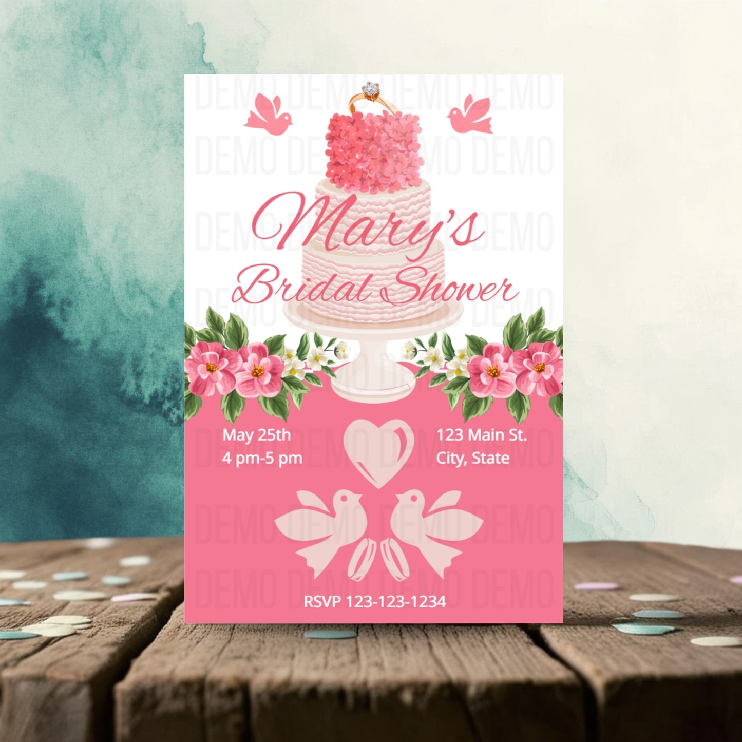 Bridal shower invitation with cake design on a wooden surface