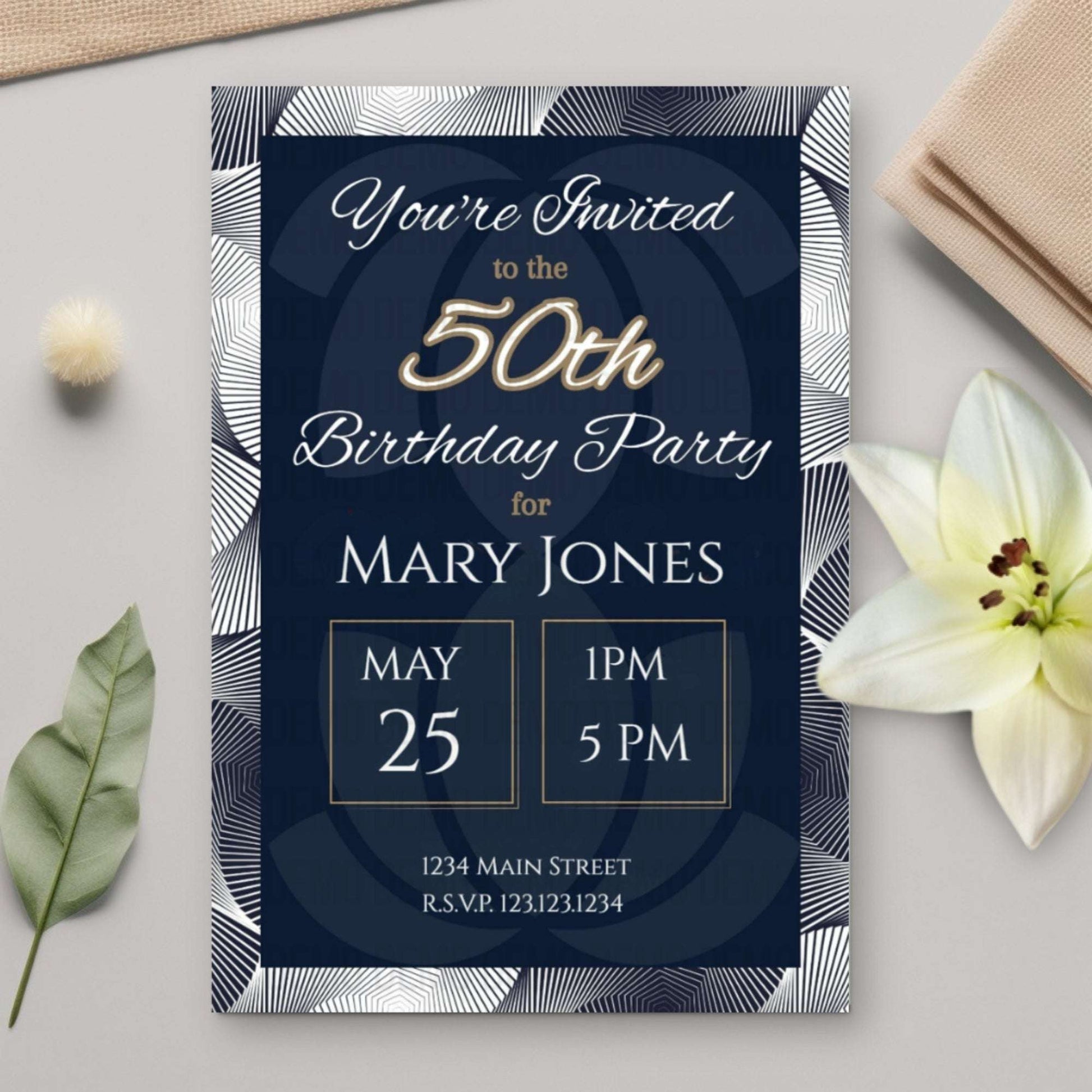 50th birthday party invitation card with decorative elements on a light surface.