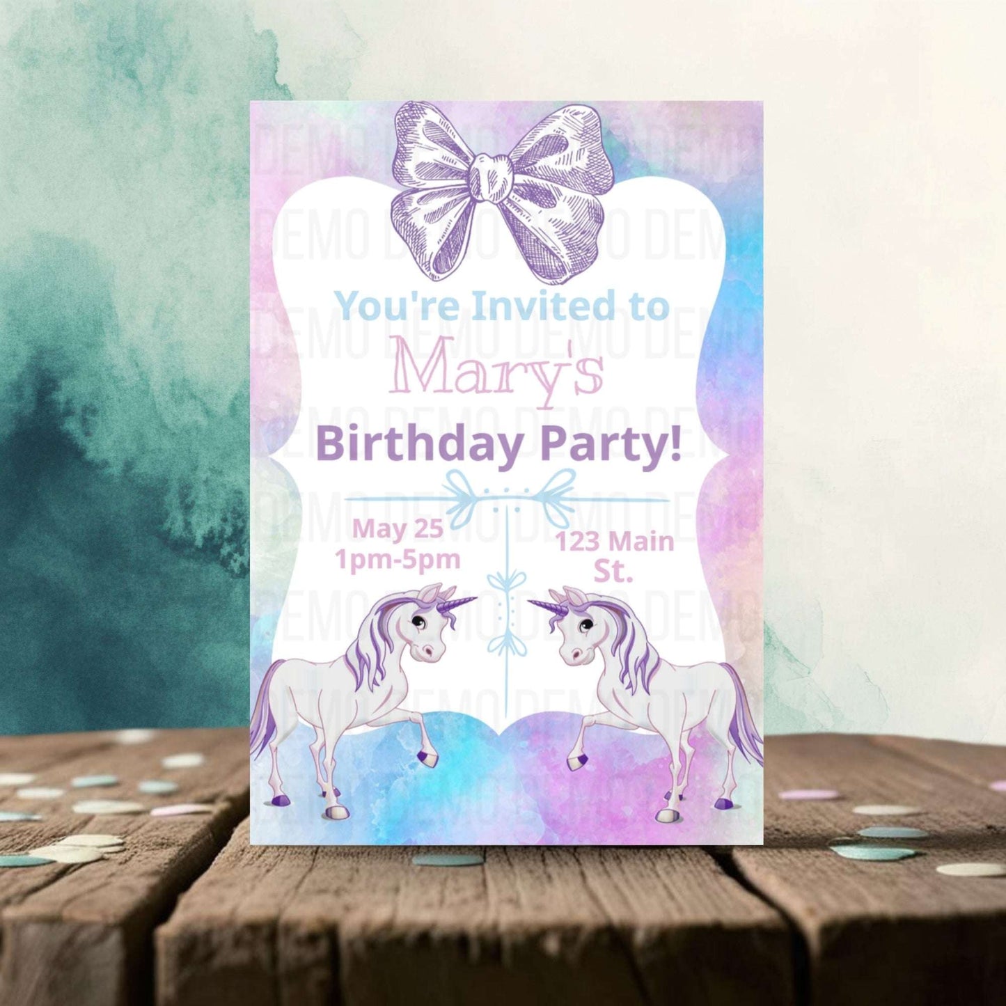 Birthday party invitation with unicorns and a bow on a watercolor background
