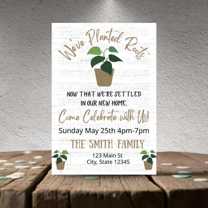 Invitation card with plant illustrations on a wooden surface and gray background
