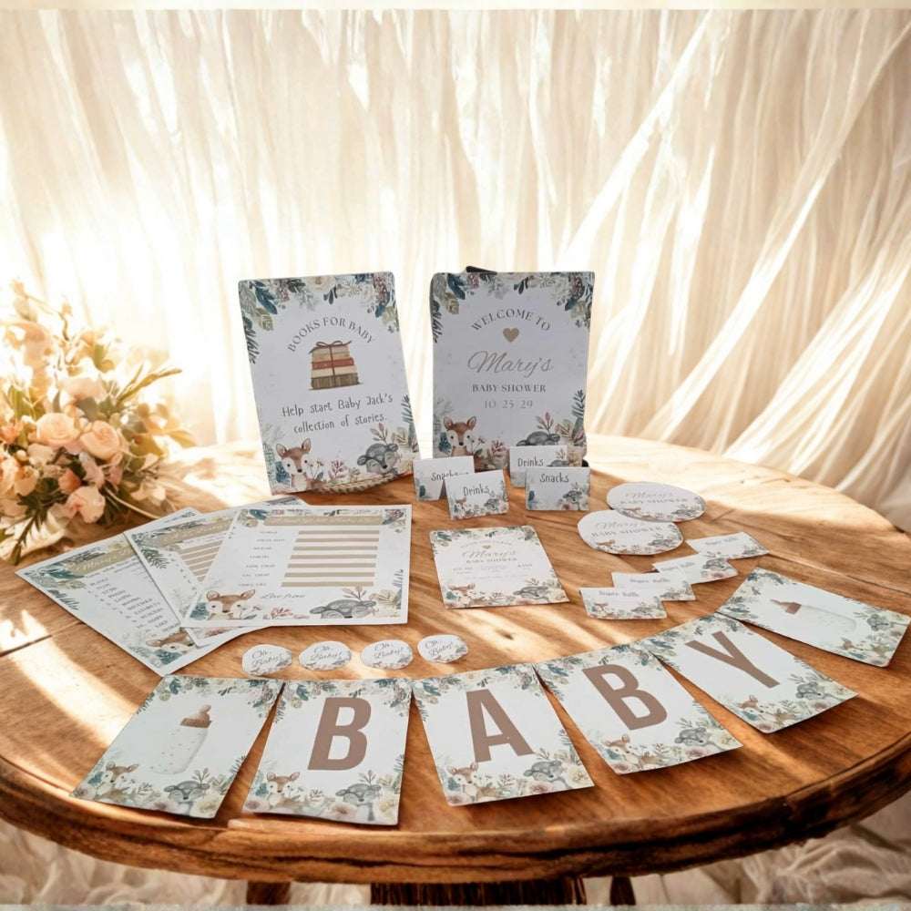 Baby shower decorations on a wooden table with floral arrangements.