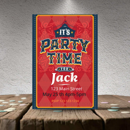 Party invitation card for 'It's Party Time for Jack' on a wooden surface with a textured gray background.