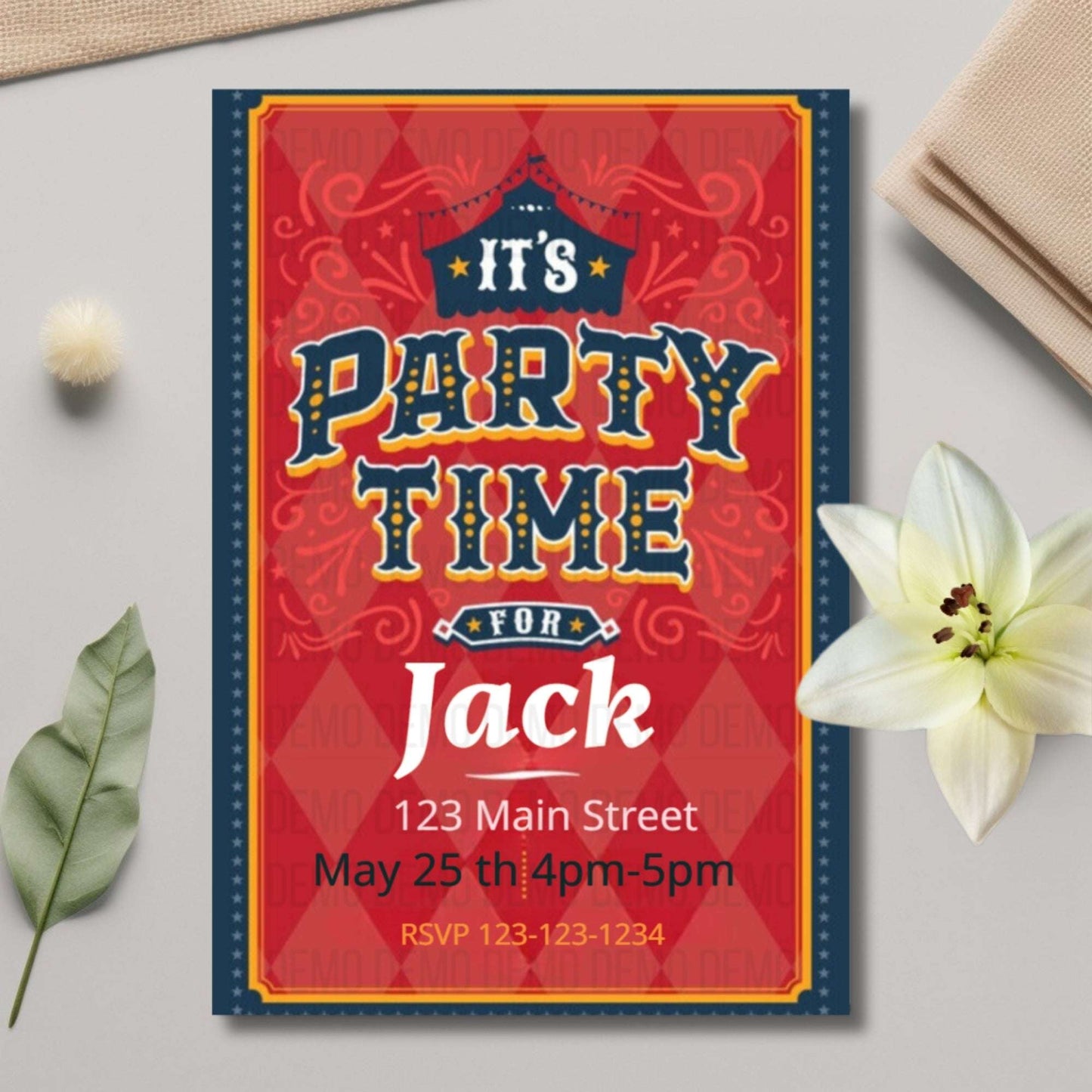 Party invitation card for 'It's Party Time for Jack' on a decorative surface with flowers and leaves.