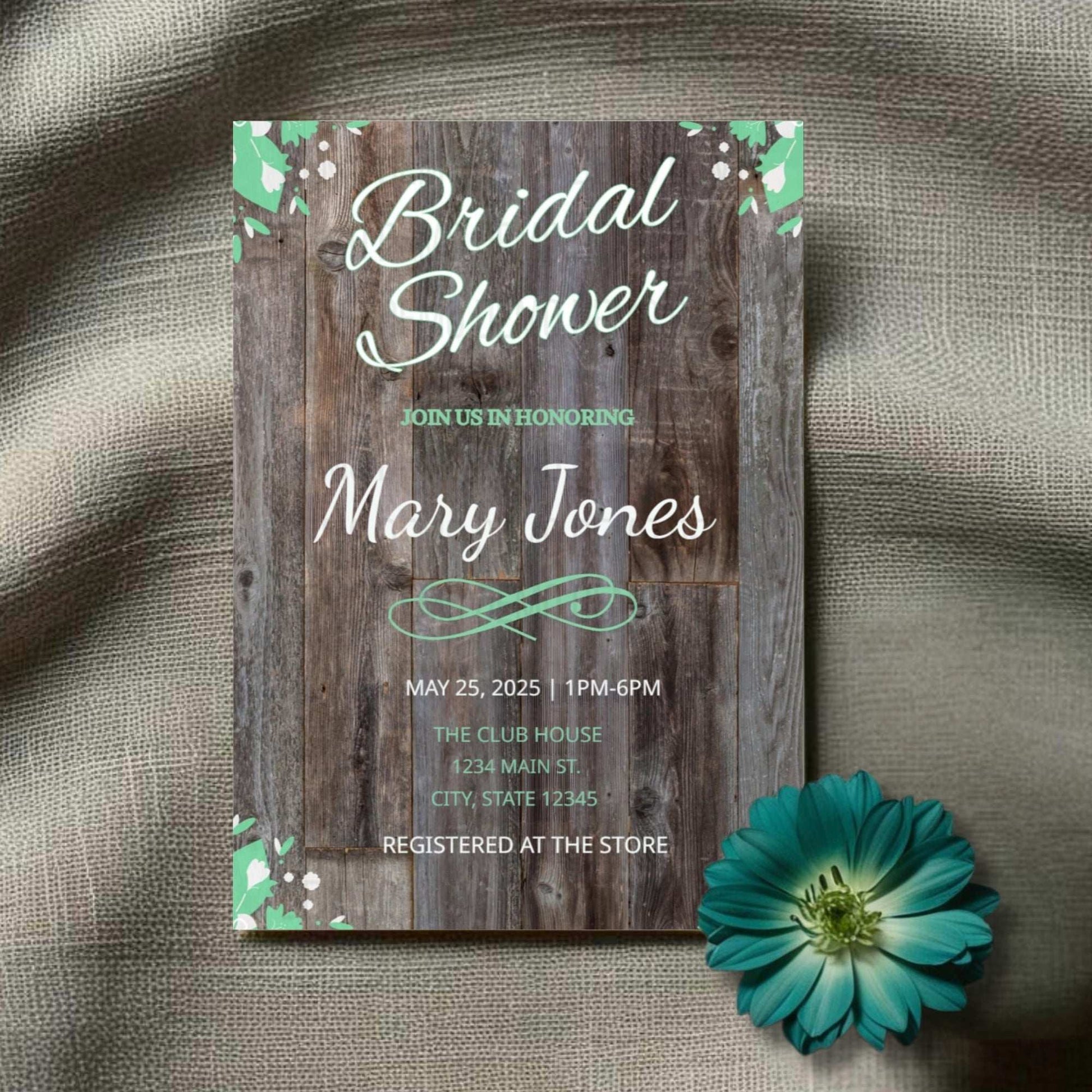 Bridal shower invitation with wooden texture and teal accents on a textured fabric background.