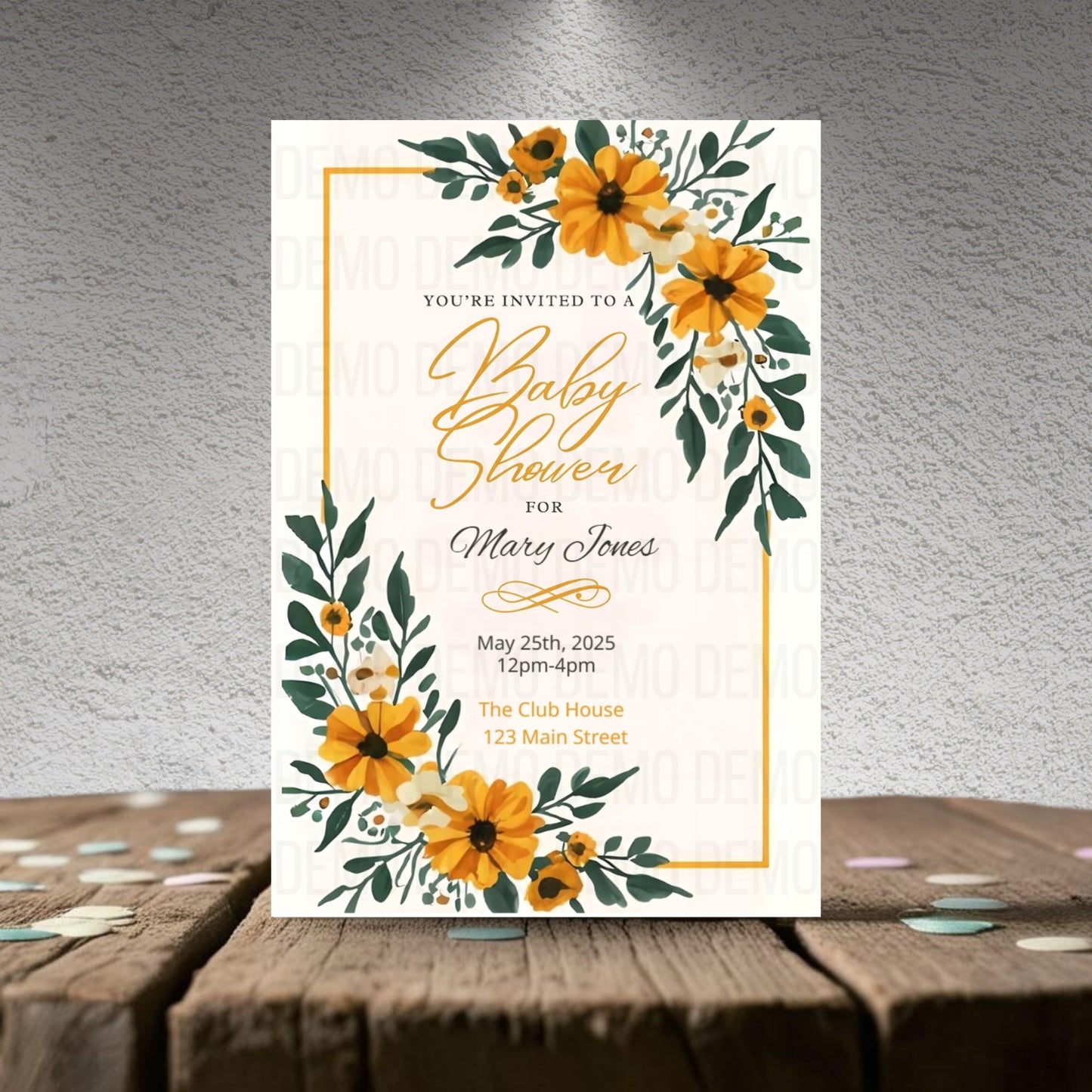 Baby shower invitation with yellow flowers on a textured surface