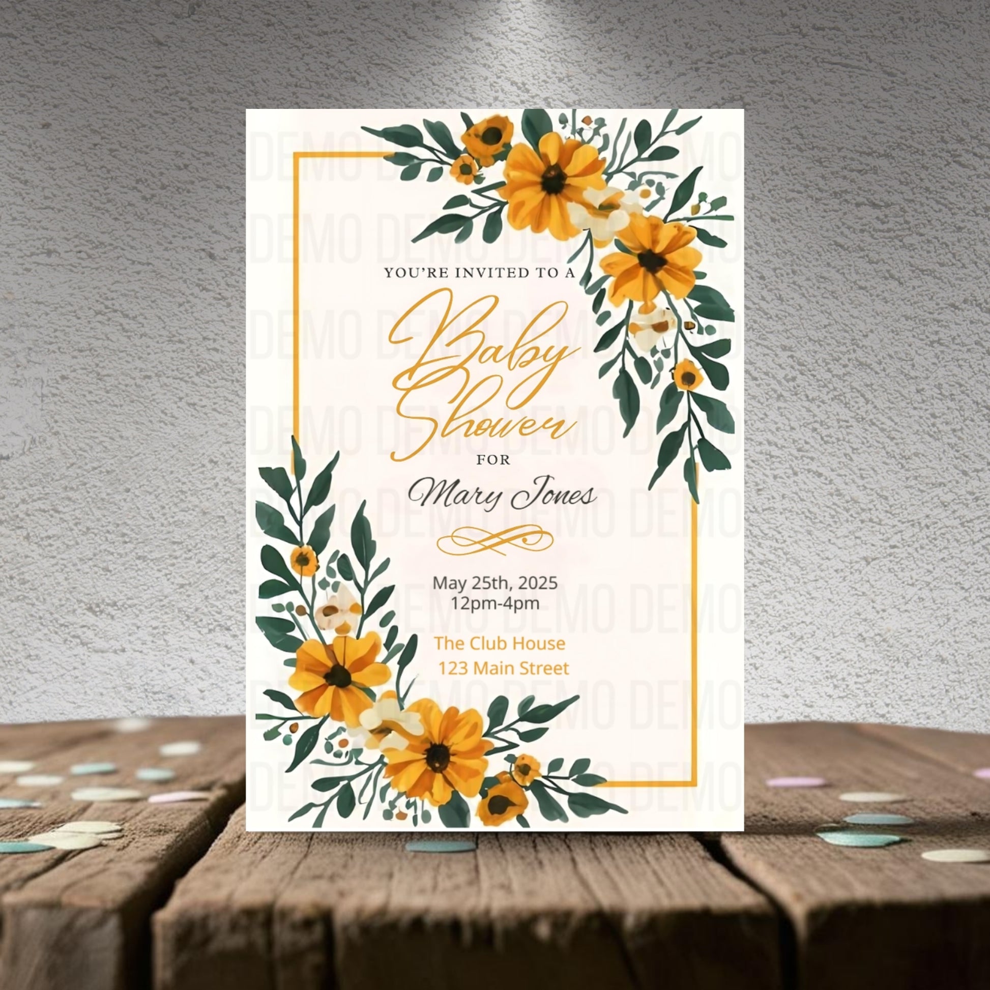 Baby shower invitation with yellow flowers on a textured surface
