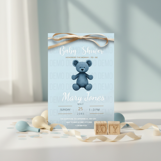 Baby shower invitation with a blue teddy bear on a light blue background, surrounded by decorative ribbons and blocks.